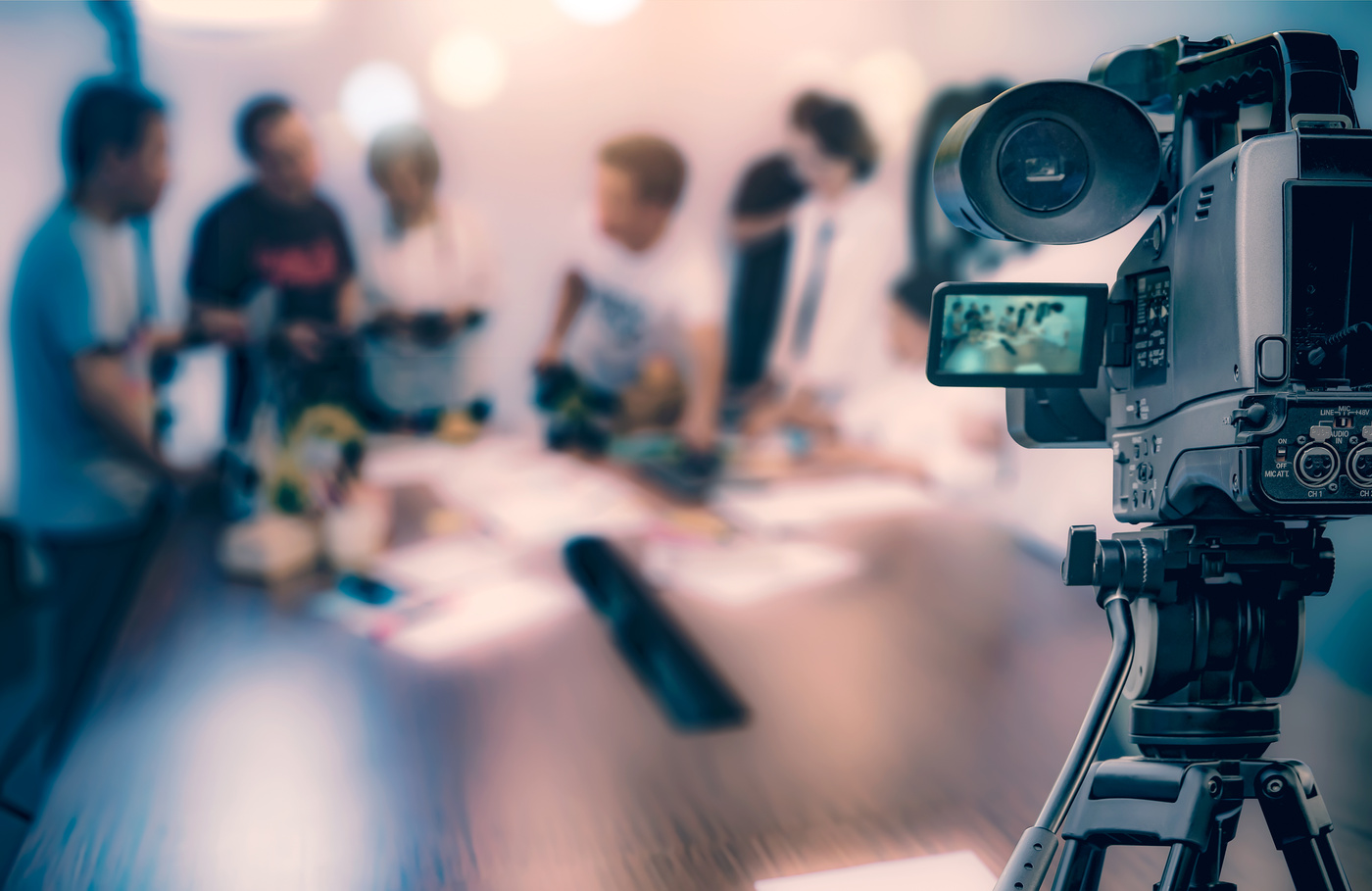 Video camera taking live video streaming at people working background